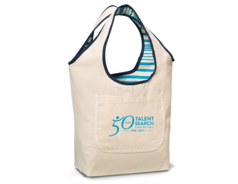 Reversible tote with on-trend graphics for added interest Large main compartment Front slash pocket on non-patterned side 18" shoulder straps